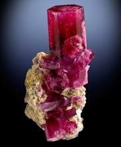 Red Beryl aka Red beryl, formerly known as bixbite and marketed as red emerald or scarlet emerald, is an extremely rare variety of beryl as well as one of the rarest minerals on Earth. The gem gets its red color from manganese ions embedded inside of beryllium aluminium cyclosilicate crystals. The color of red beryl is stable up to 1,000 °C (1,830 °F).